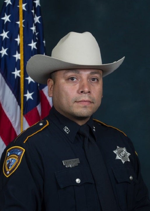 Two men charged in shooting death of off-duty Texas deputy in grocery store parking lot