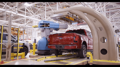The F-150 Lightnings bed scales are tested by a large robotic device.