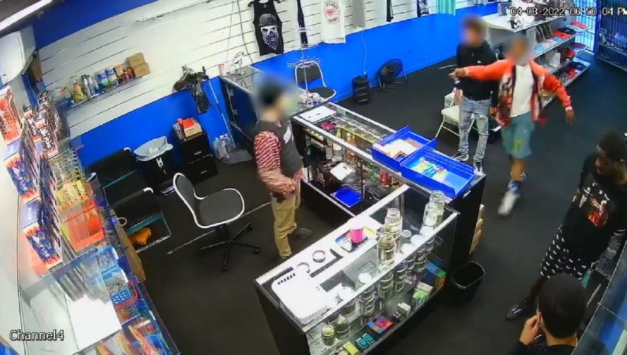 Los Angeles armed suspects scramble for cover after employee whips out his own gun