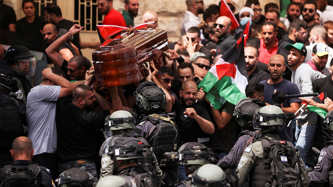 Israeli police clash with mourners carrying casket of Al Jazeera journalist Shireen Abu Akleh