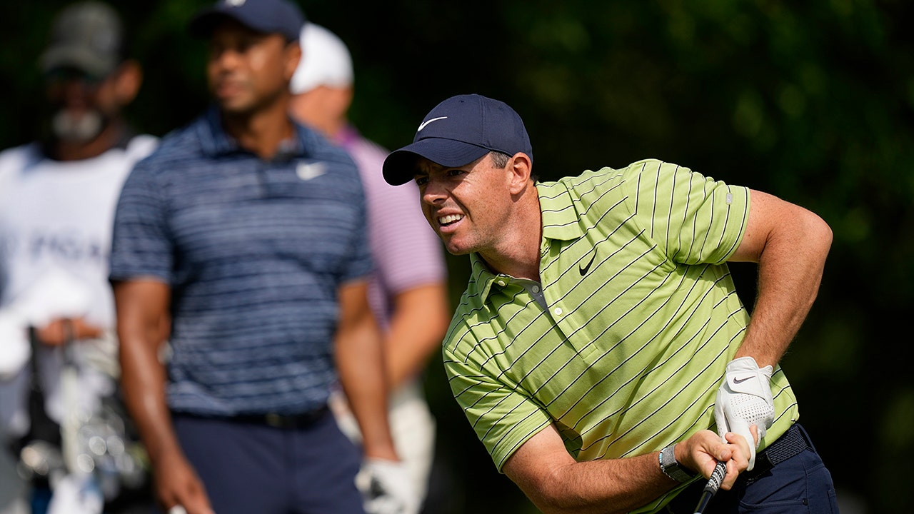 PGA Championship: Rory McIlroy finishes first round as leader Tiger Woods fights