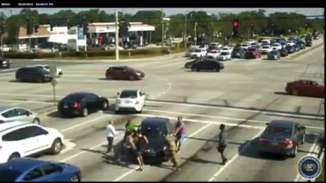 Florida police release video of Good Samaritans racing to rescue woman who had medical emergency while driving