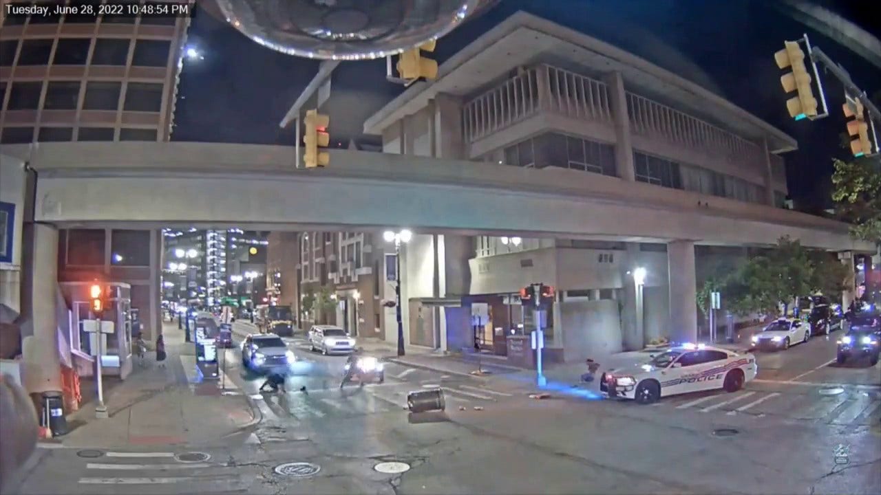 Detroit police release video of three-wheeler nearly running over officer