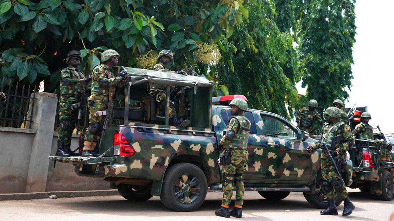 Nigerian church shooting: authorities hunt for gunmen in attack that killed at least 50, including children