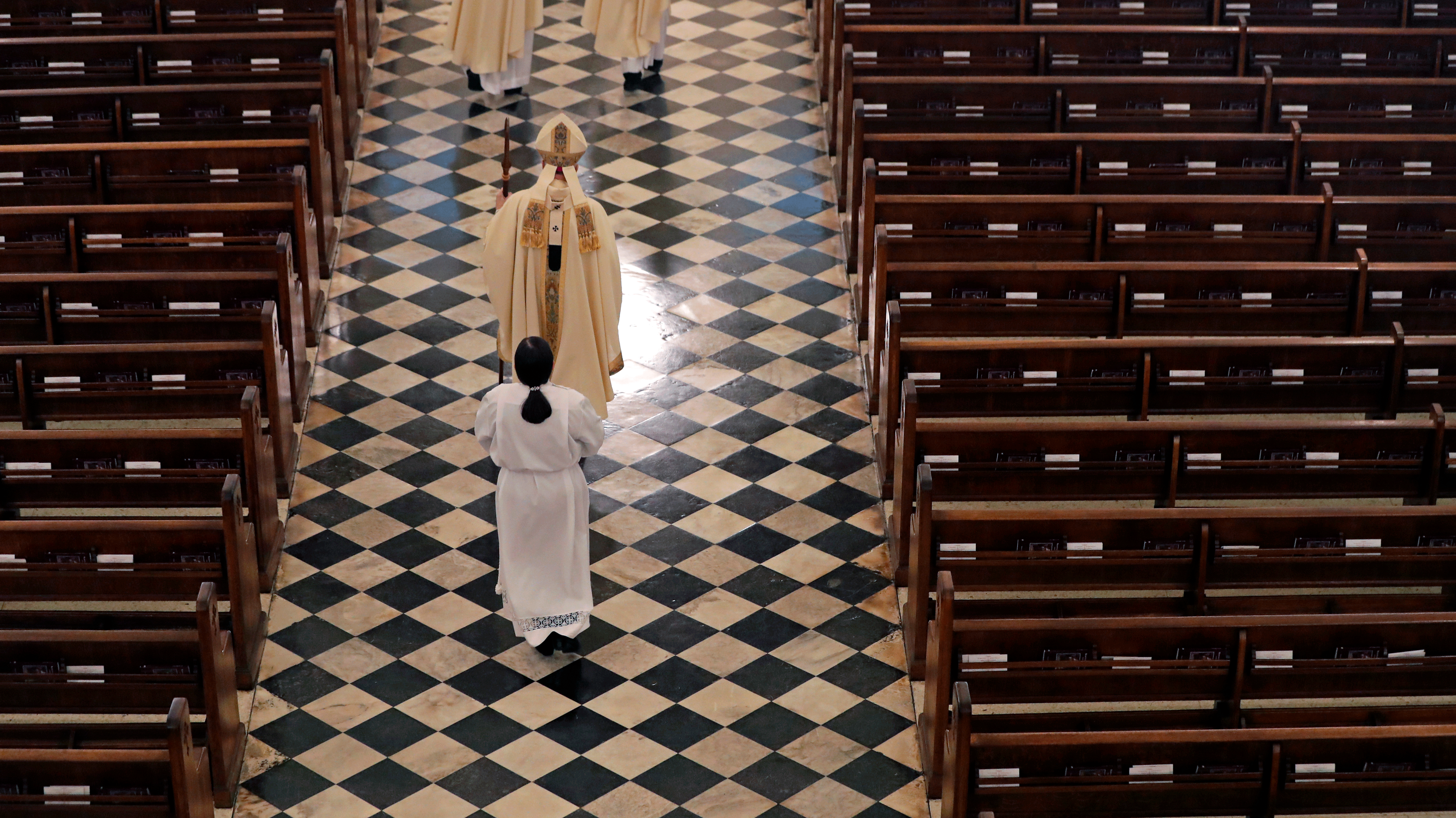 Archbishop Gregory Aymond conducts the procession during a livestreamed Easter Mass in St. Louis Cathedral in New Orleans, April 12, 2020.