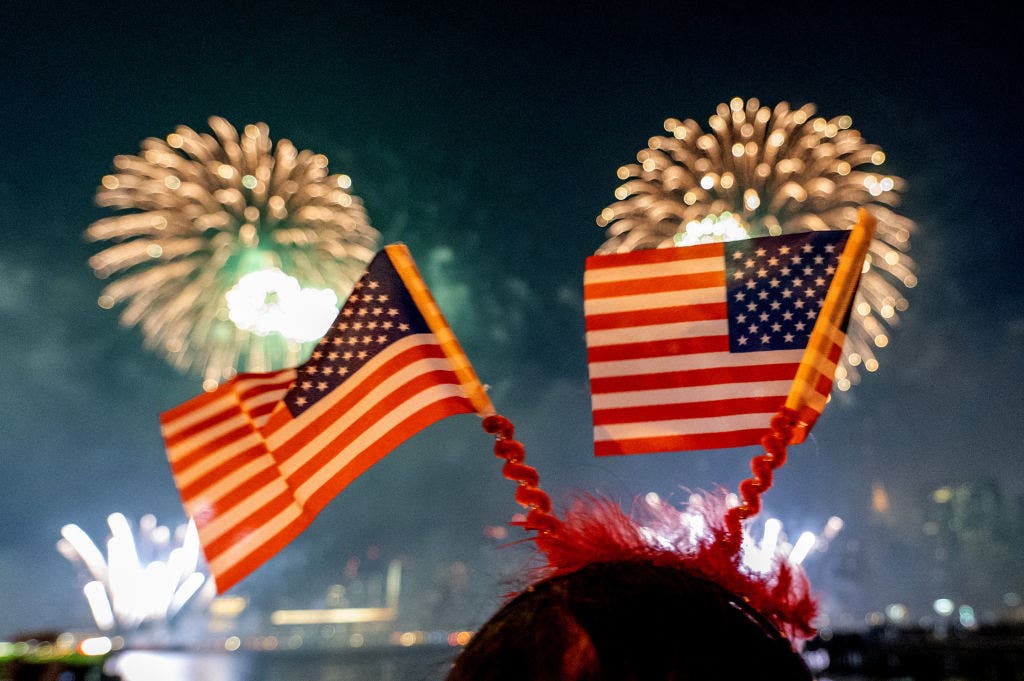 Girl watches the 4th of July fireworks