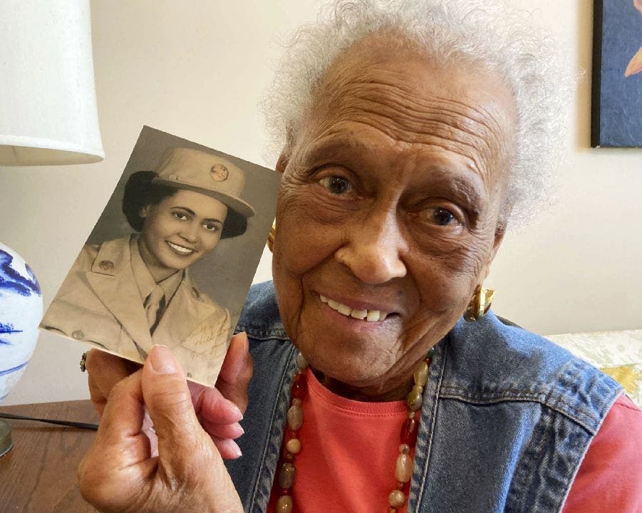 Romay Davis, 102, poses with her World War II portrait. She served in the 6888th Central Postal Directory Battalion. (AP Photo/Jay Reeves)