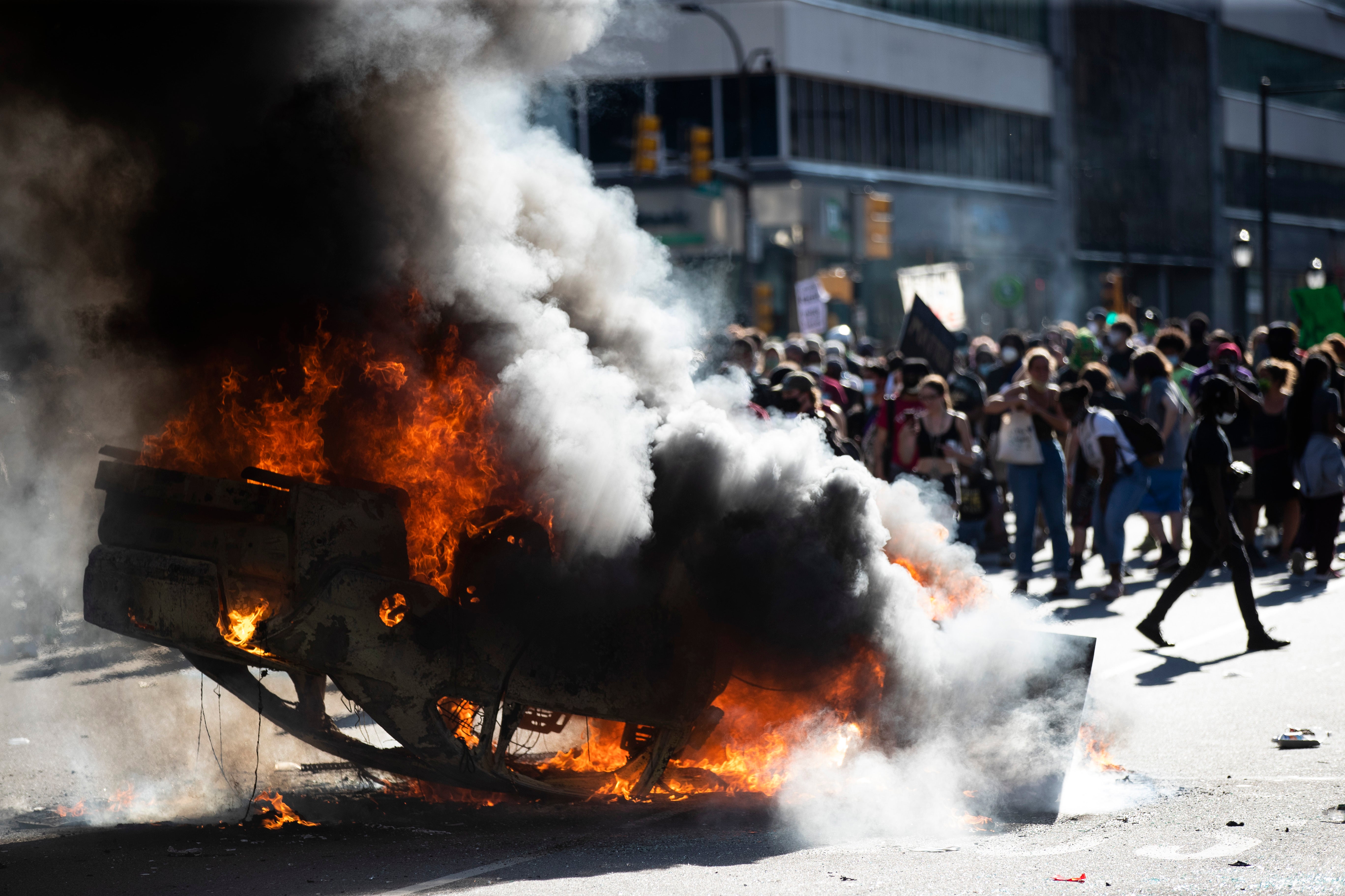 police car set on fire during george floyd riot