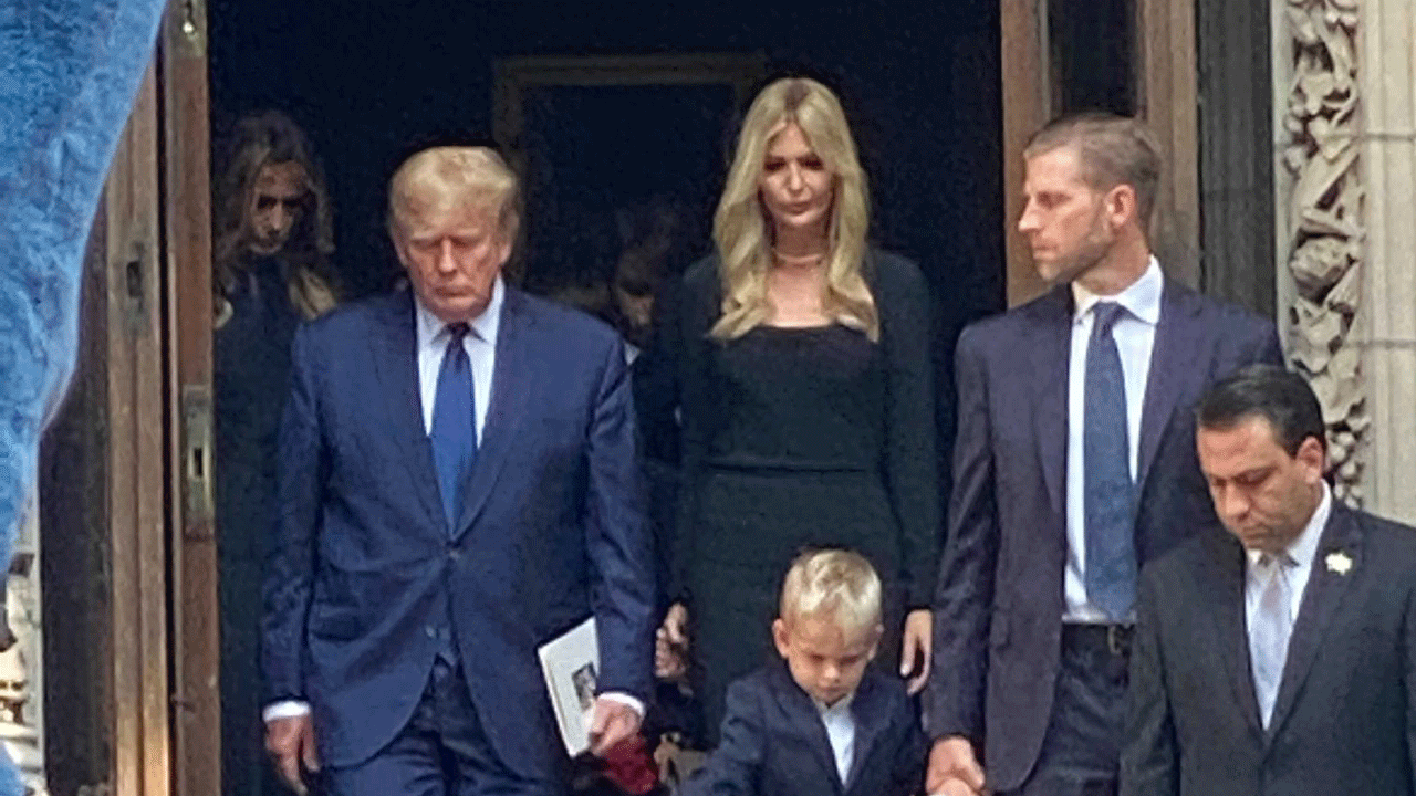 Former President Donald Trump exits from Ivana Trump's funeral alongside his children, Ivanka Trump and Eric Trump.