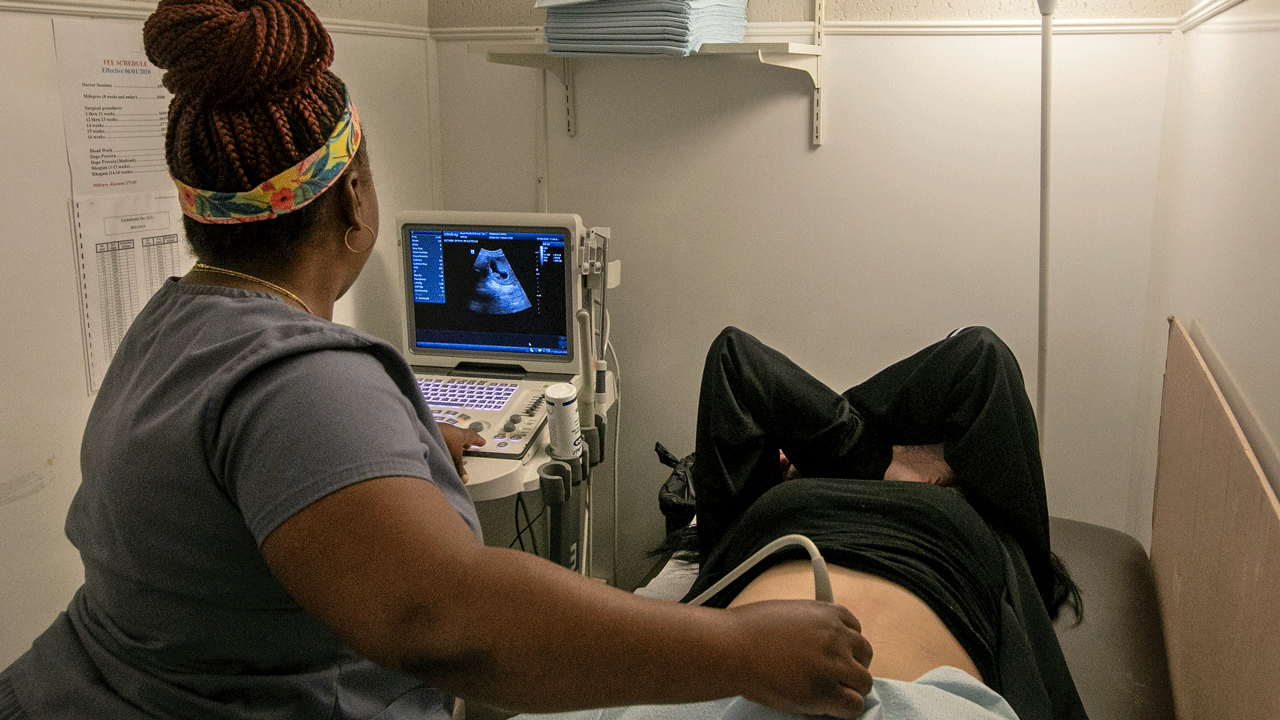 An operating room technician performs an ultrasound on a patient at Hope Medical Group for Women in Shreveport, La., on July 6, 2022. 