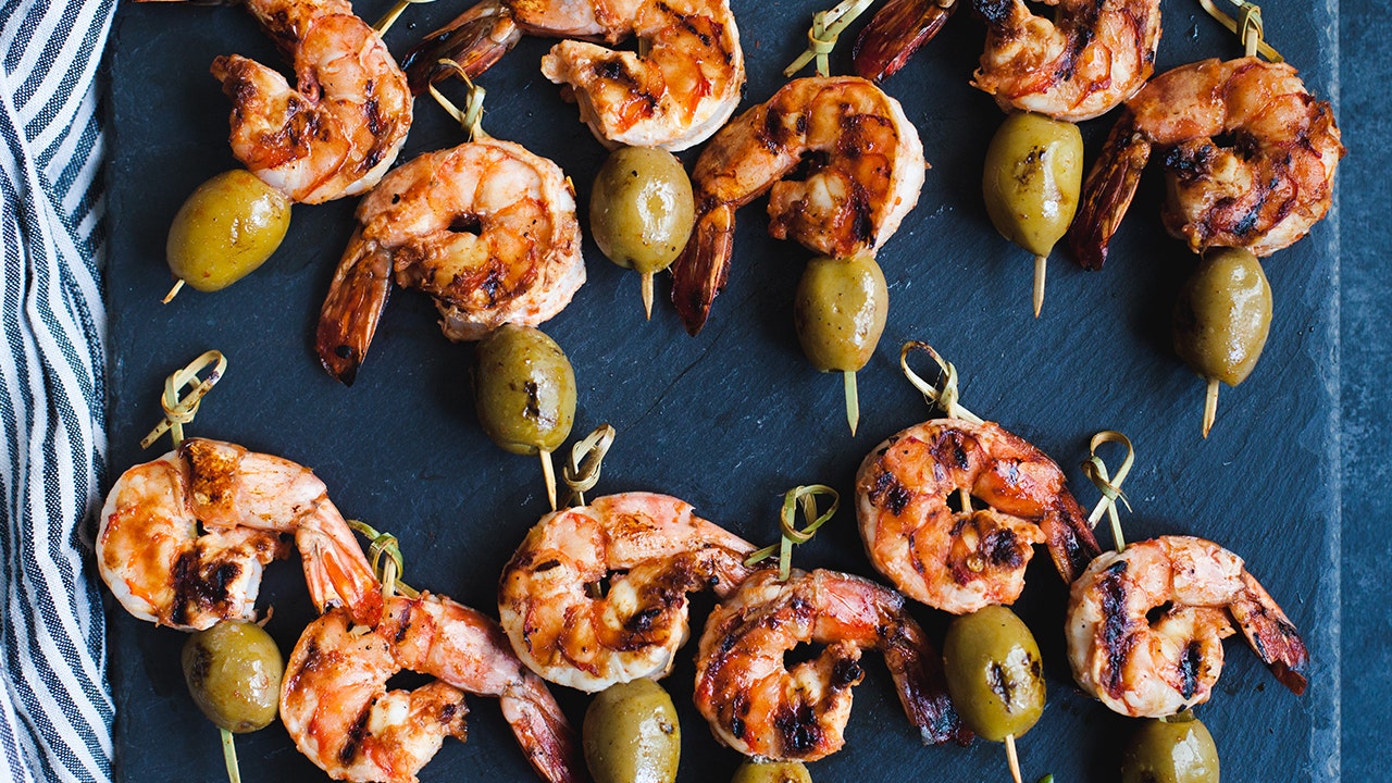 Try these spice shrimp and olive skewers for your next potluck dinner or cookout. (Musco Family Olive Co.)