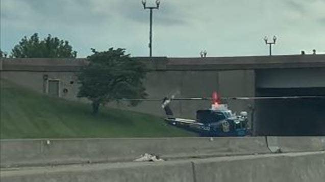 US Park Police helicopter lands on DC freeway to rescue motorcycle officer after accident