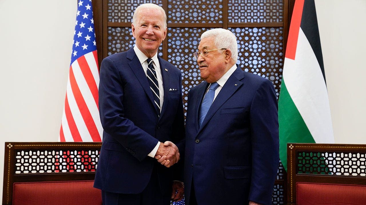 Palestinian President Mahmoud Abbas and U.S. President Joe Biden shake hands in the West Bank town of Bethlehem, Friday, July 15, 2022. (AP Photo/Evan Vucci)