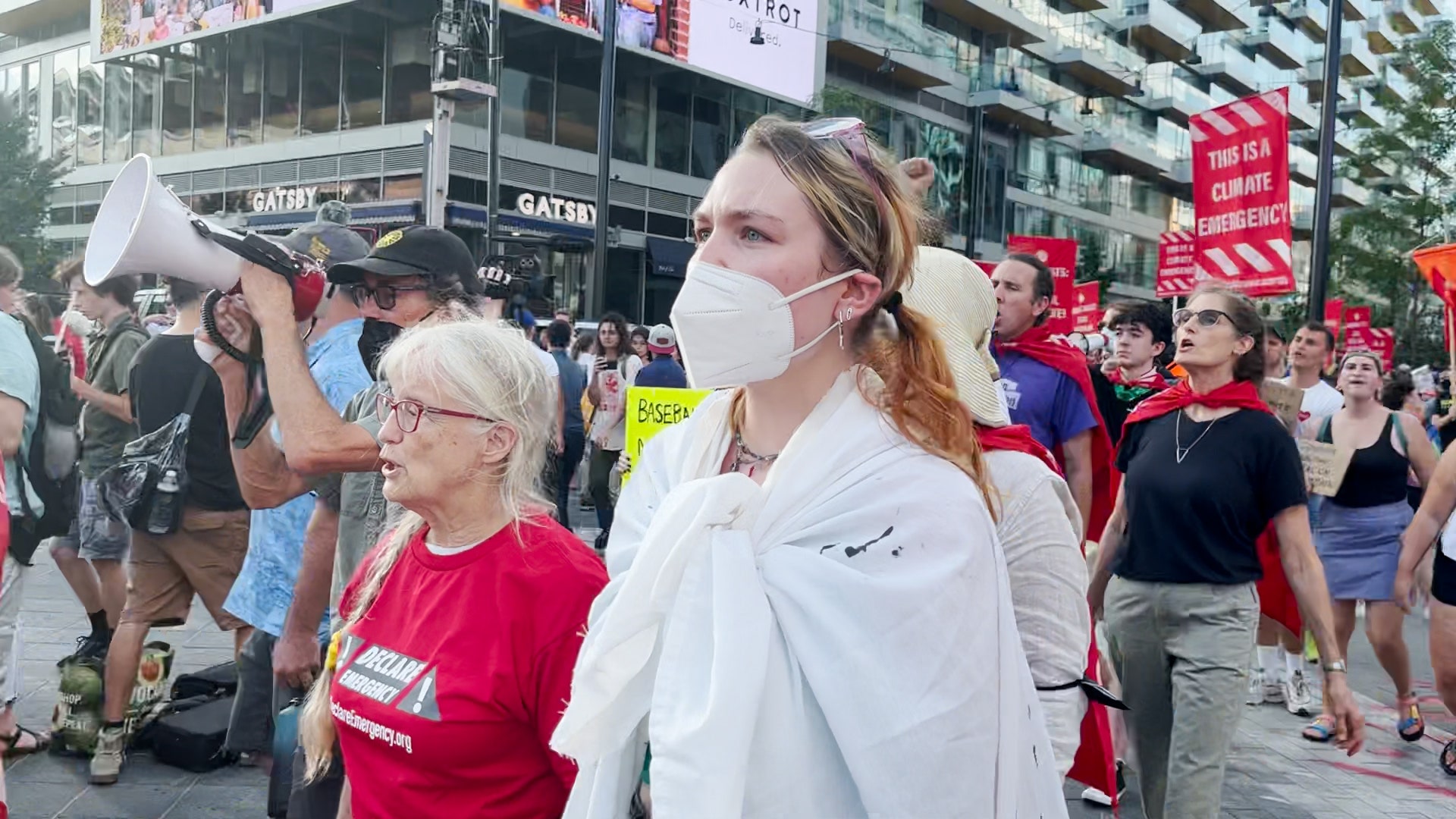 Climate activists demand Biden declare climate emergency while blockading entrance to Nationals Park