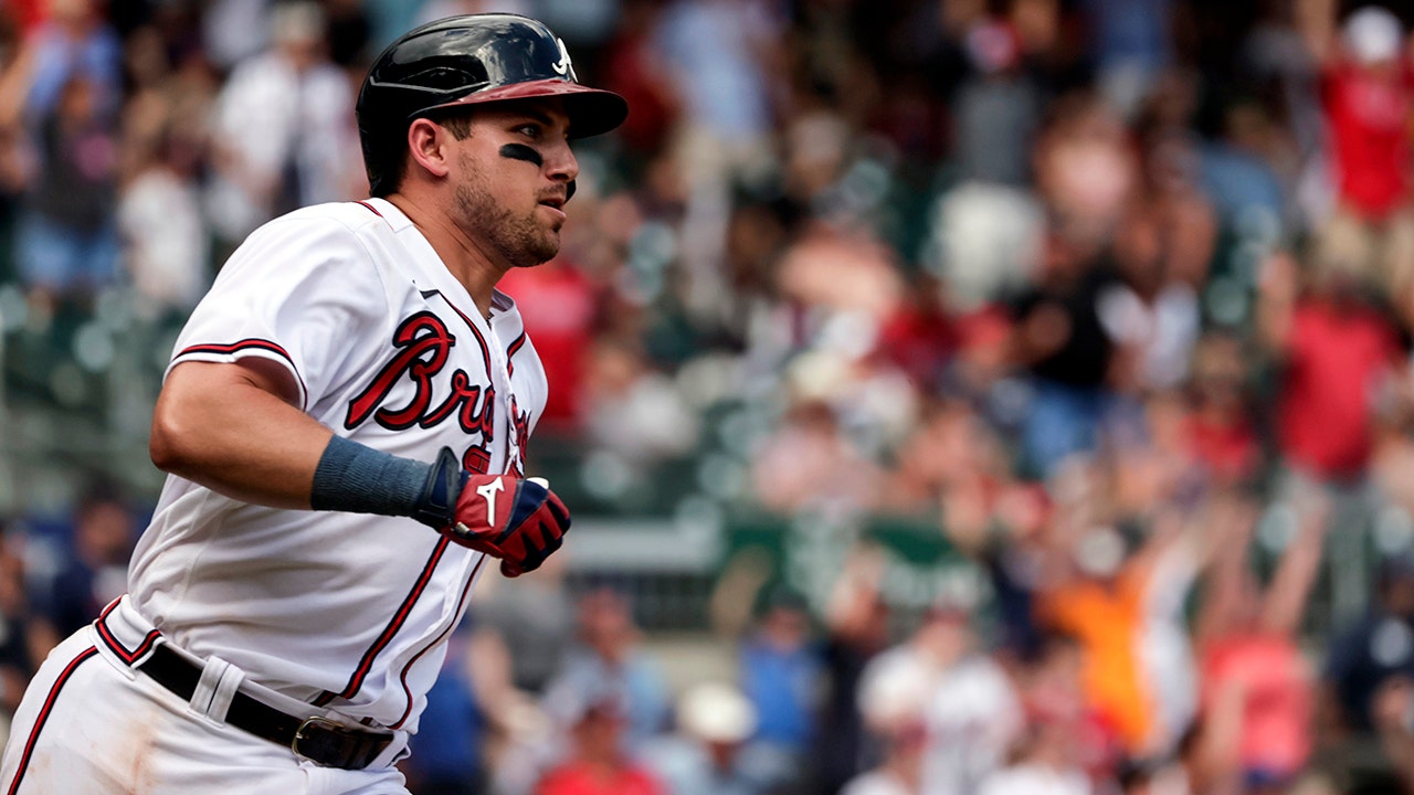 Austin Riley of the Atlanta Braves celebrates with teammates after