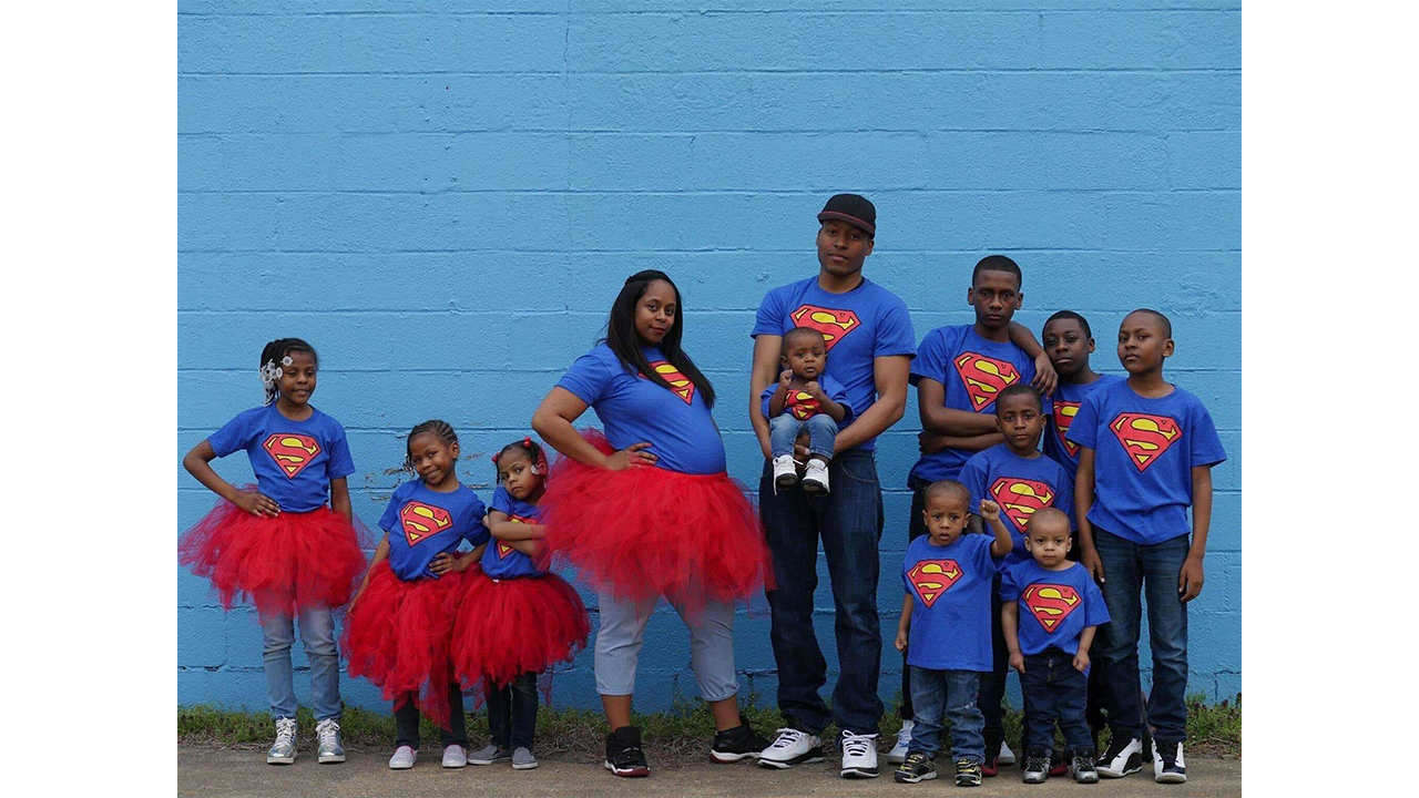 Pictured here are Iris and Cordell Purnell with 10 of their children. At the time, Iris was pregnant with their 11th child. She gave birth in 2017. (Photo courtesy the Purnell family)