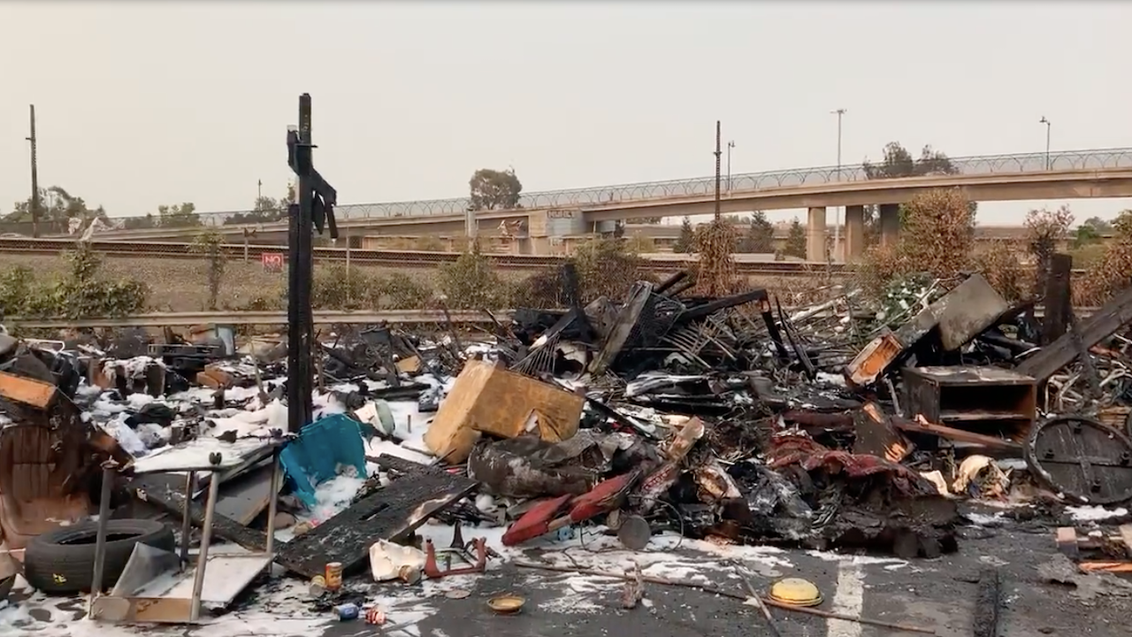 Exteriors of burned-down Oakland homeless camp