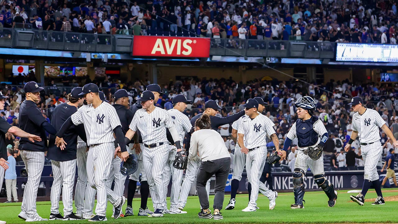 Yankees fan drinks beer through makeshift hot dog straw, divides
