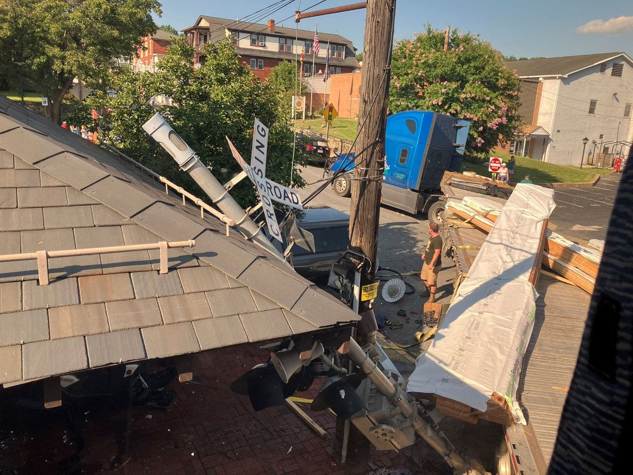 Maryland Amtrak train hits flatbed truck trapped on tracks by traffic