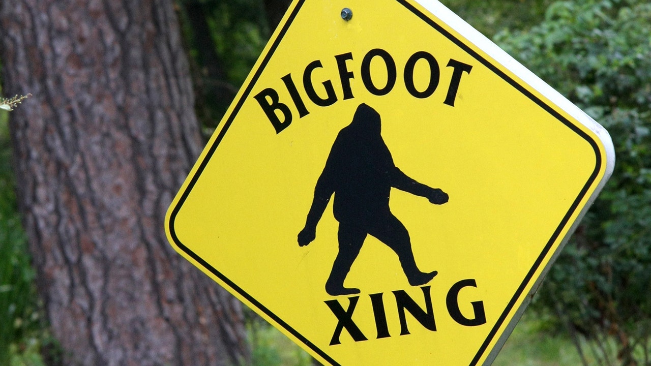 A bright yellow street sign warning of Bigfoot Crossing. Some people believe this tall, hairy creature exists. (JLFCapture/iStock)