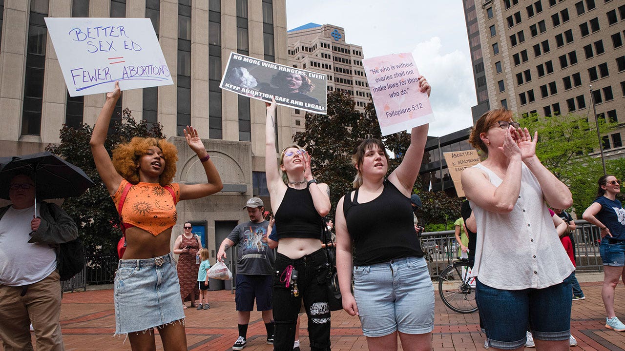 pro-choice protesters with signs