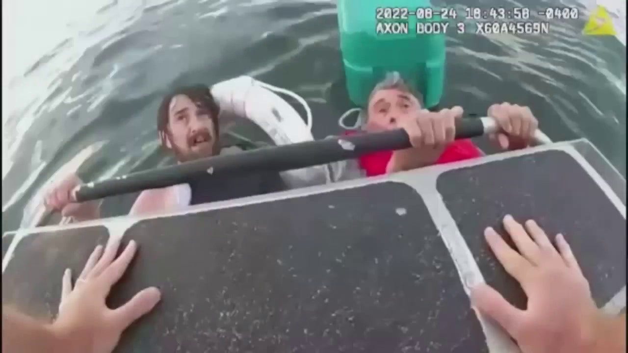 Video shows moment when father and son were rescued by Boston Harbor police...
