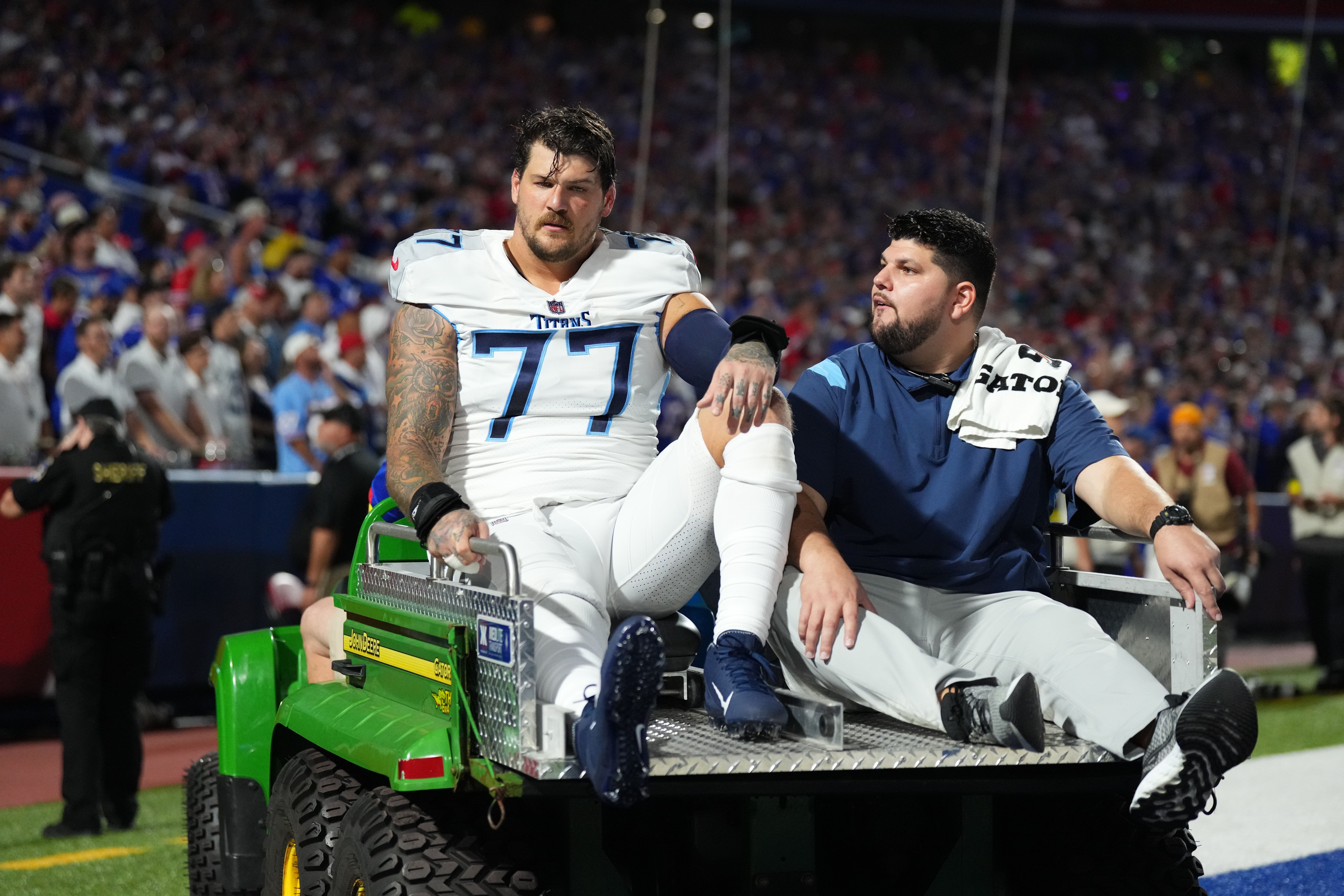 Titans’ Taylor Lewan out for season after suffering knee injury against Bills