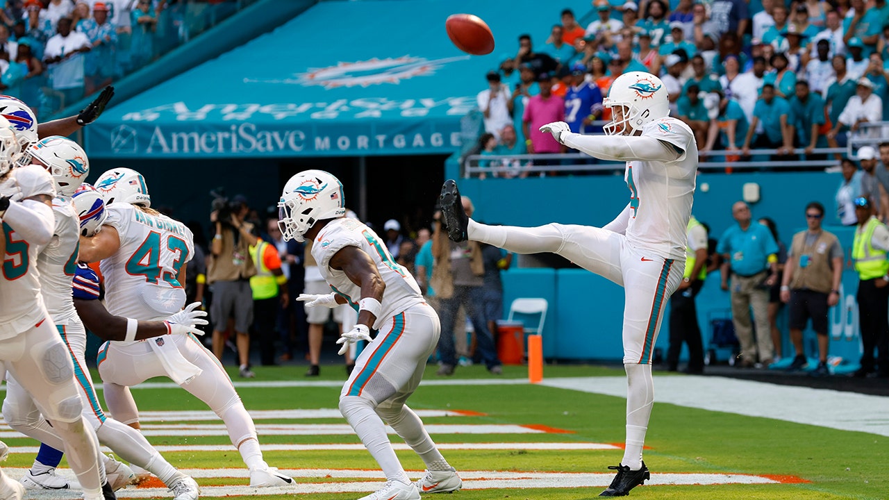 Miami Dolphins punter Thomas Morstead (4) punts during an NFL wild