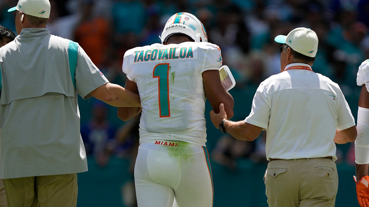 Dolphins’ Tua Tagovailoa appears woozy after taking hit, briefly leaves game with head injury