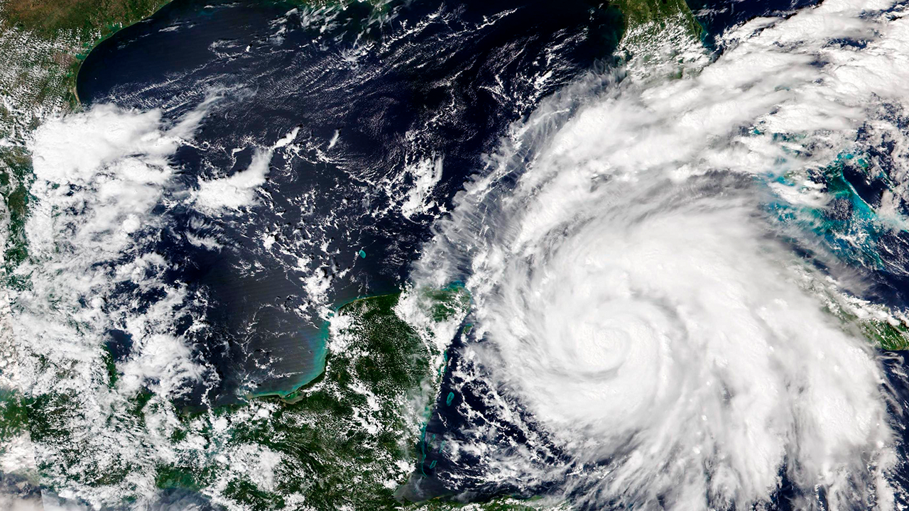 This Sept. 26, 2022, satellite image released by NASA shows Hurricane Ian growing stronger as it barreled toward Cuba. Ian was forecast to hit the western tip of Cuba as a major hurricane and then become an even stronger Category 4 with top winds of 140 mph (225 km/h) over warm Gulf of Mexico waters before striking Florida.