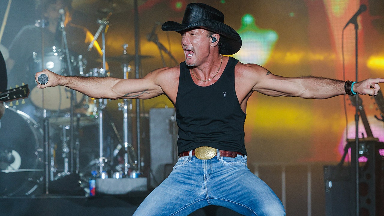Country star Tim McGraw takes a tumble at his concert and falls into fans