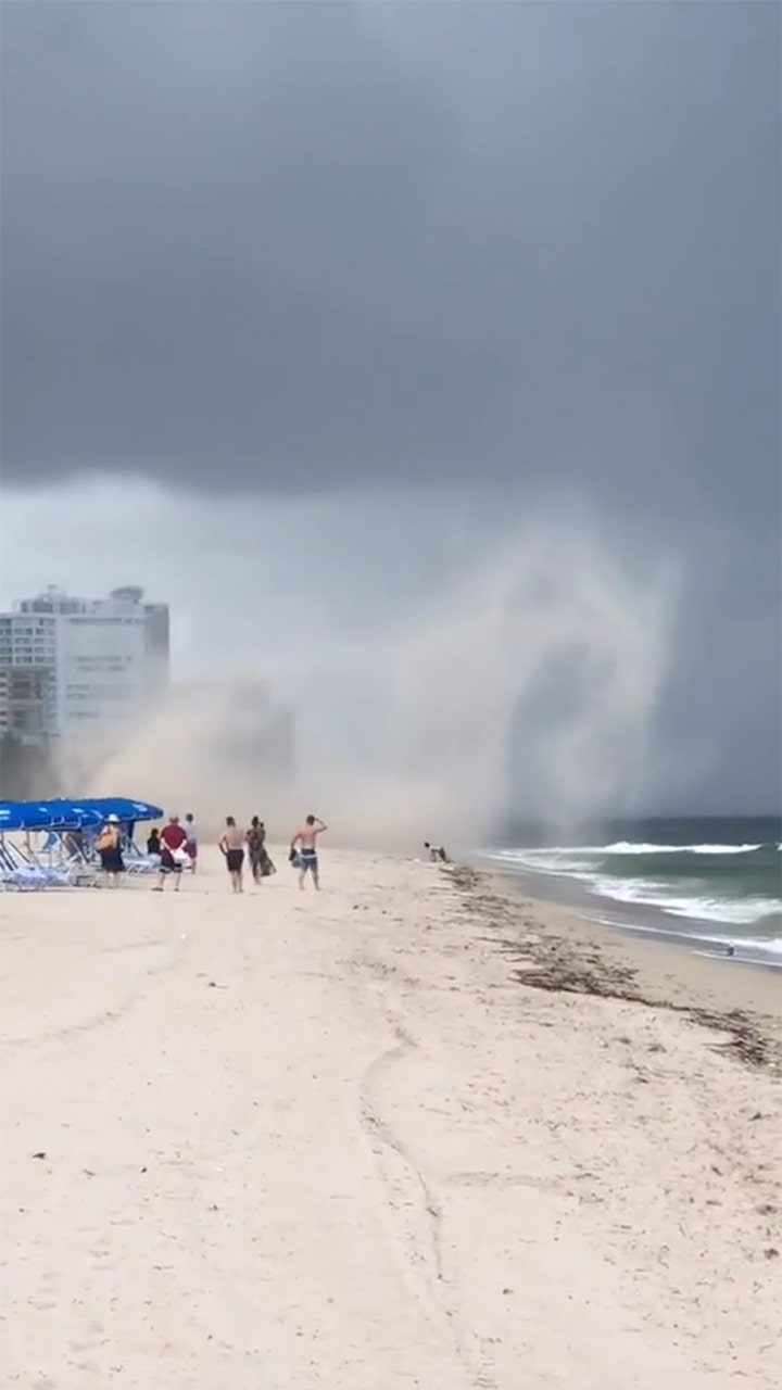 Shocking video shows Florida beach storm throwing umbrellas into the air