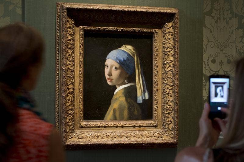 Climate activist glues his head to ‘Girl with a Pearl Earring’ painting in The Hague