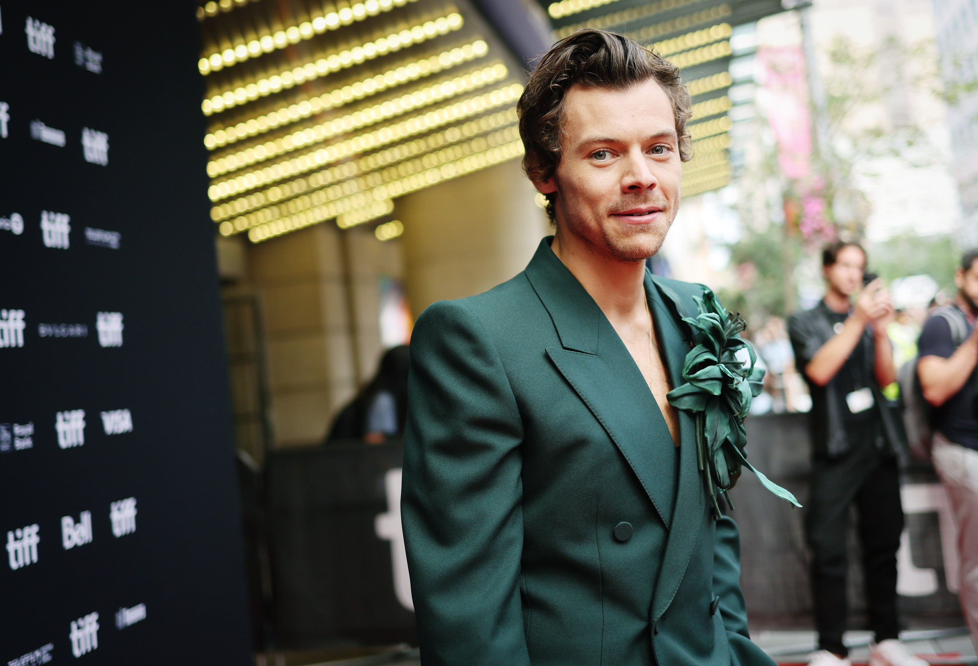 Harry Styles in a green suit