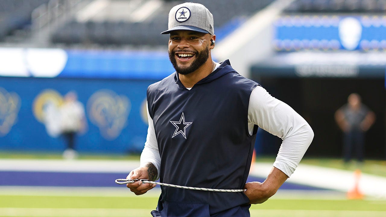 Dallas Cowboys quarterback Dan Prescott warms up before the NFL News  Photo - Getty Images