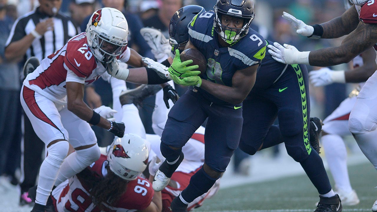 Running back Kenneth Walker III of the Seattle Seahawks is tackled