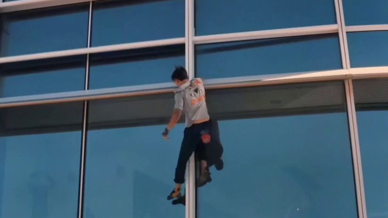'Pro-life Spiderman' weaves his web climbing skyscrapers to protest abortion