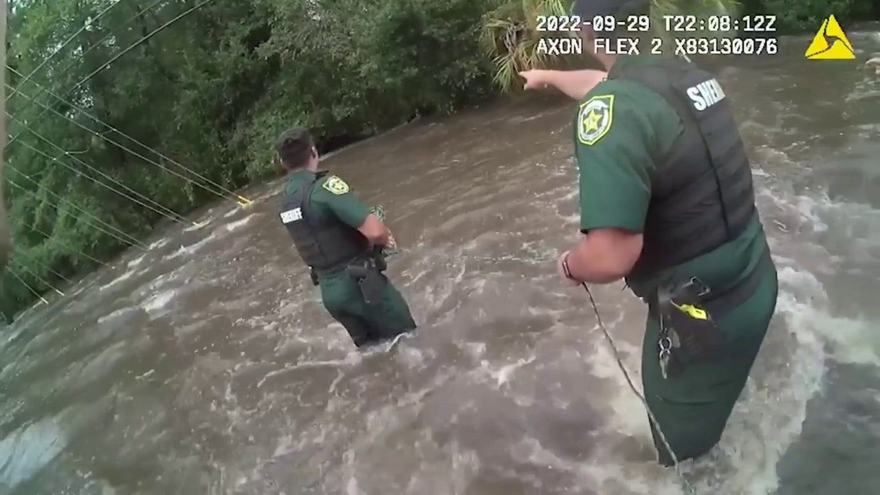 Florida deputies rescue woman from rushing floodwaters after her car was swept away