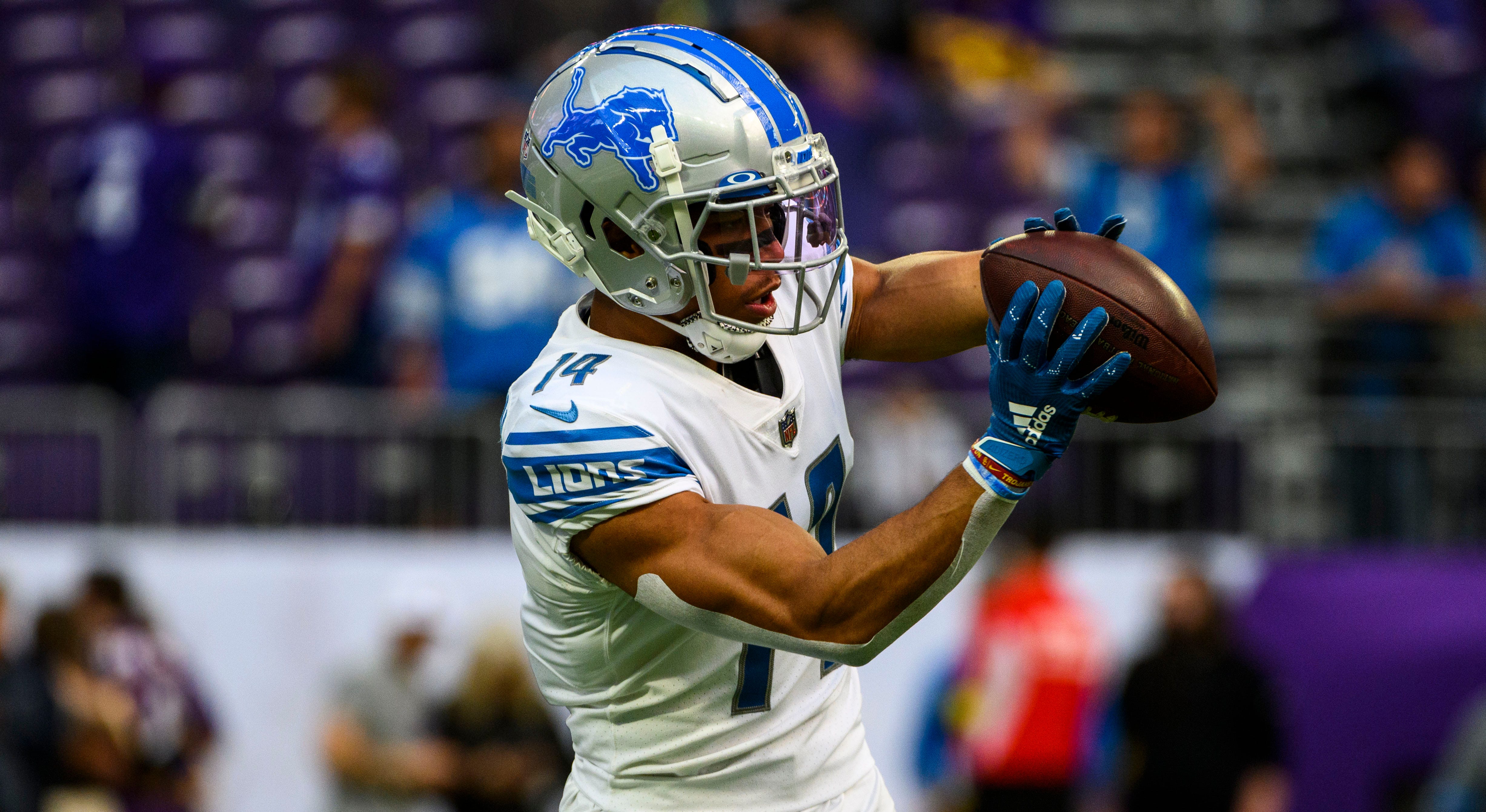 Detroit Lions wide receiver Amon-Ra St. Brown (14) runs a route