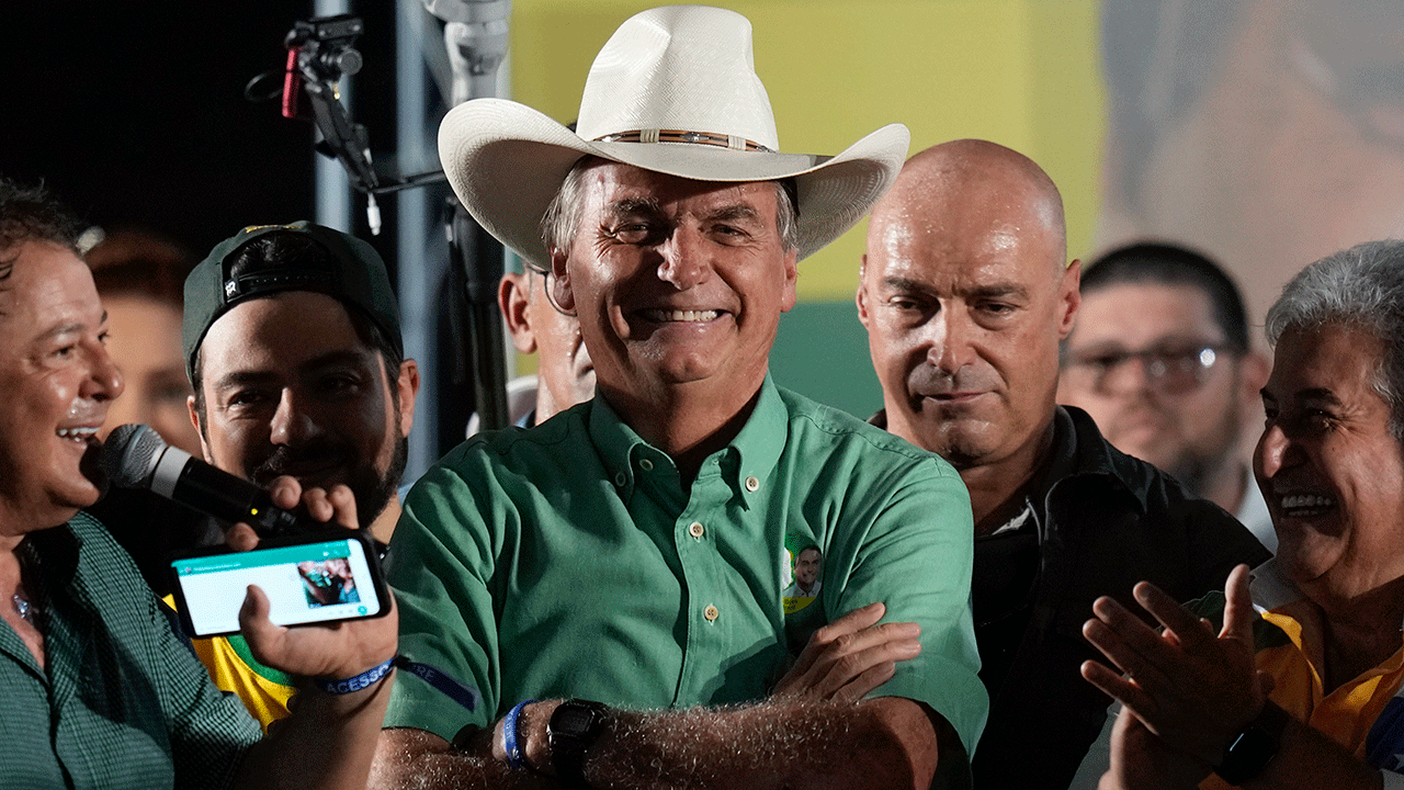 Brazil's President Jair Bolsonaro, who is running for a second term, smiles during a campaign rally in Guarulhos, the great Sao Paulo area, Brazil, Saturday, Oct. 22, 2022. Bolsonaro will face Brazil's former President Luiz Inacio Lula da Silva in a presidential runoff on Oct. 30.