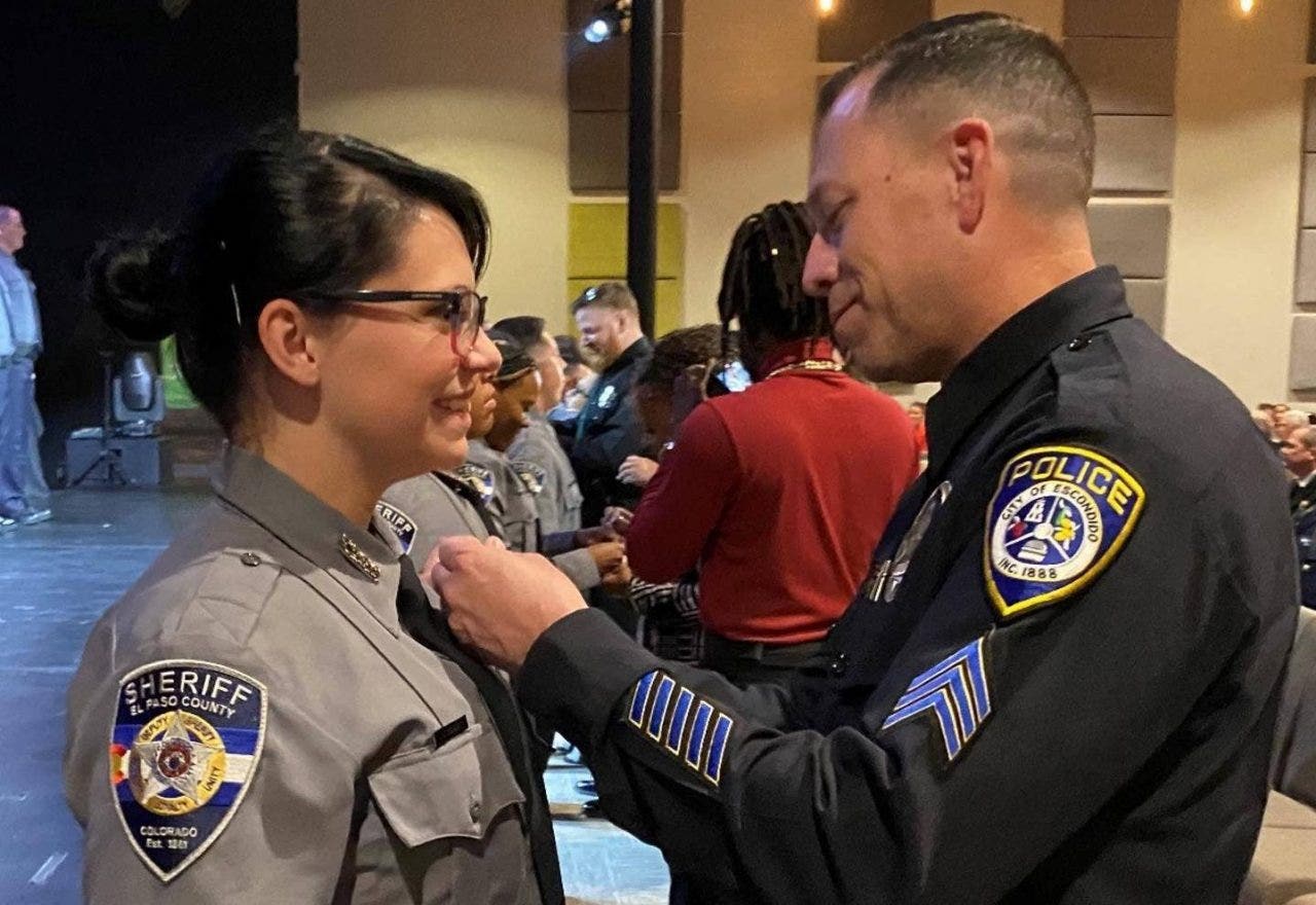 Colorado deputy pinned at graduation ceremony by officer who saved her life decades earlier
