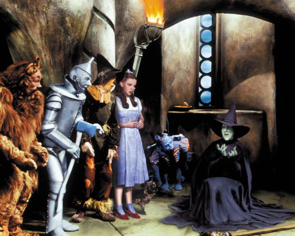 Actors Bert Lahr (1895-1967), Jack Haley (1897-1979), Ray Bolger (1904-1987), Judy Garland (1922-1969), and Margaret Hamilton (1902-1985) are all in costume in this publicity still from the film, 