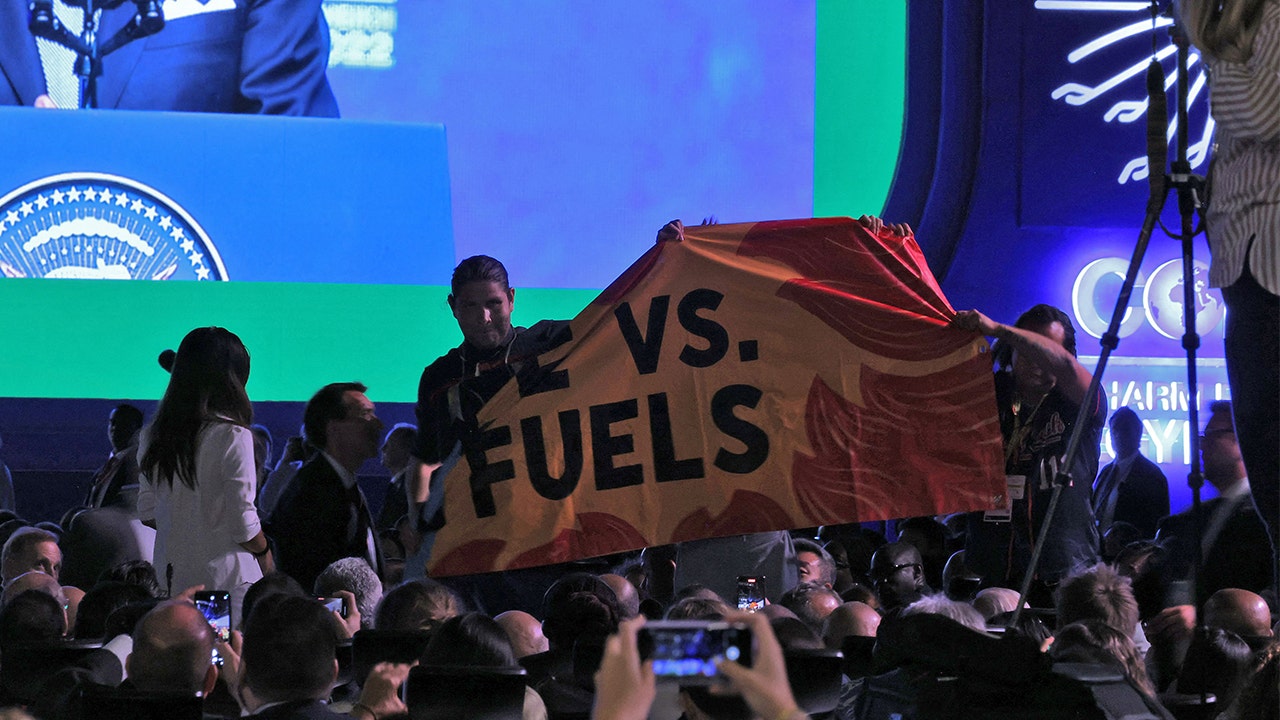 Biden interrupted by protesters at COP27 as he calls for 'transformational changes' to prevent 'climate hell'