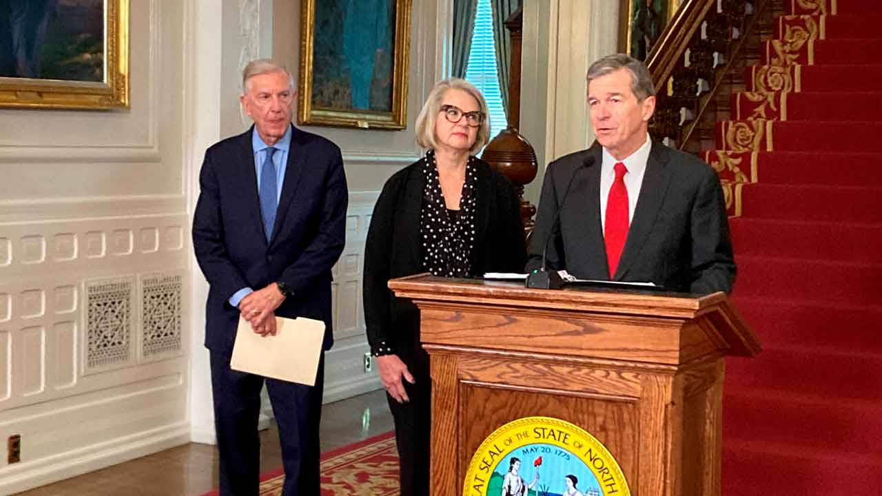 FILE - North Carolina Governor Roy Cooper leaves the court