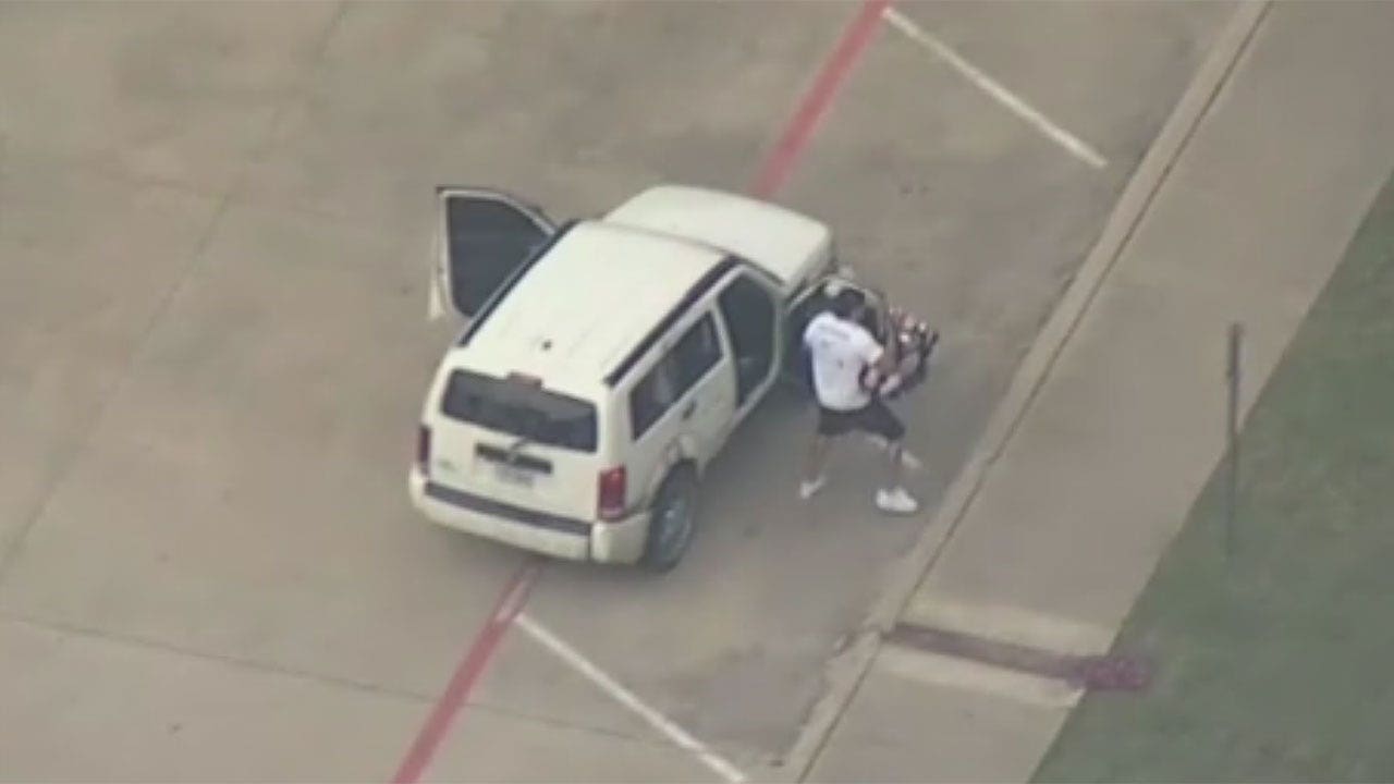 Two men arrested after wild police chase with baby in car