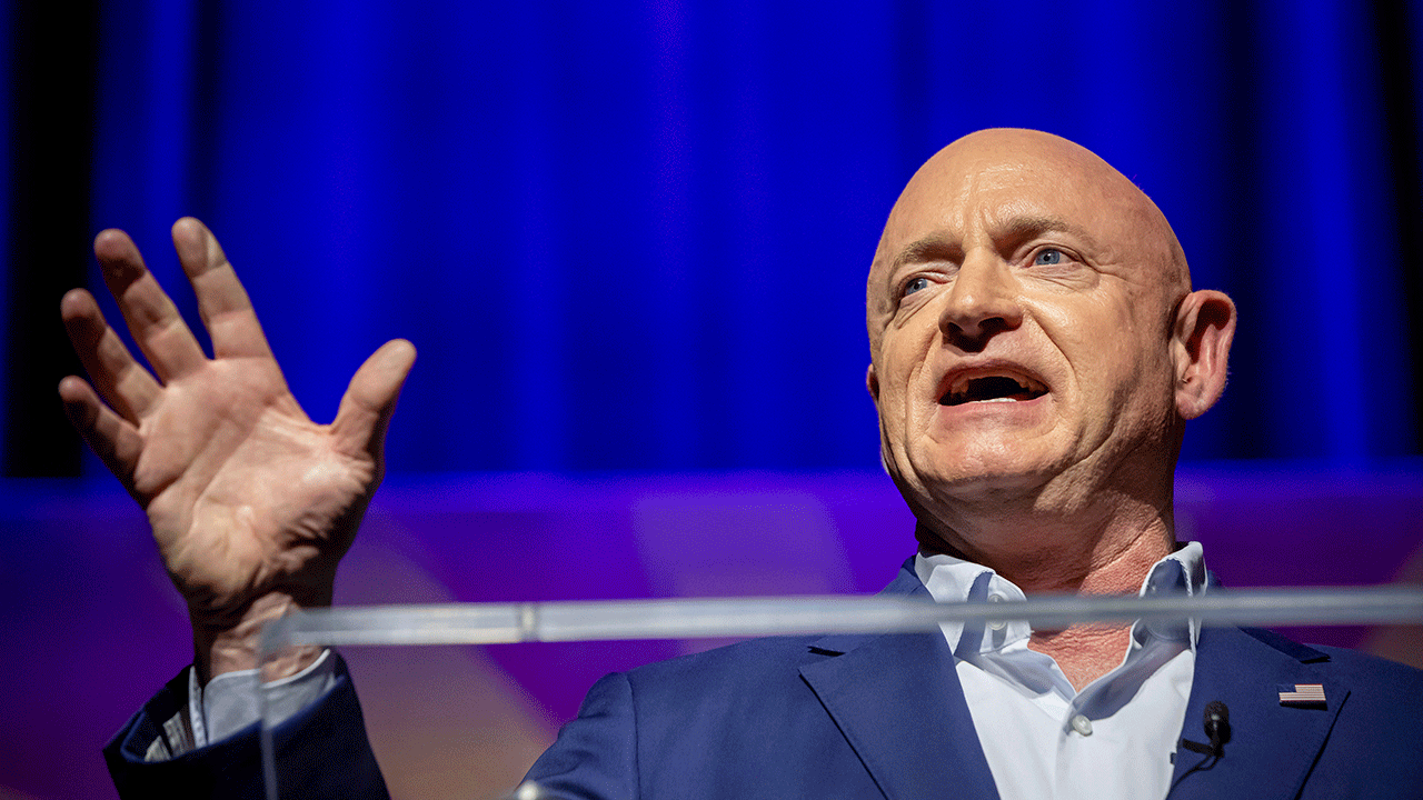 Sen. Mark Kelly addresses supporters at an election night