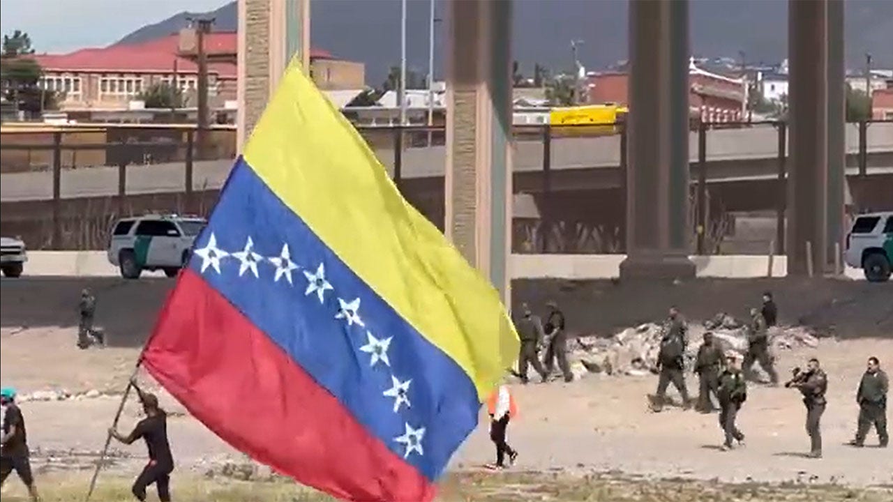 Illegal migrants wave Venezuelan flag after crossing US southern border, attack Border Patrol agents