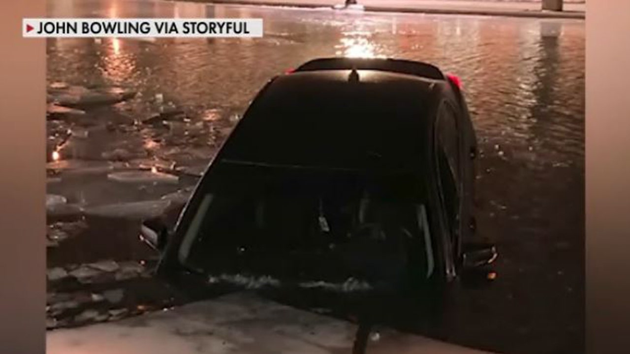 News :Viral video shows Indianapolis woman driving car on frozen canal before going through the ice