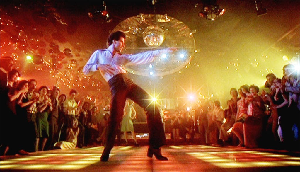 On this day in history, December 14, 1977, 'Saturday Night Fever' debuts, capturing disco era in America