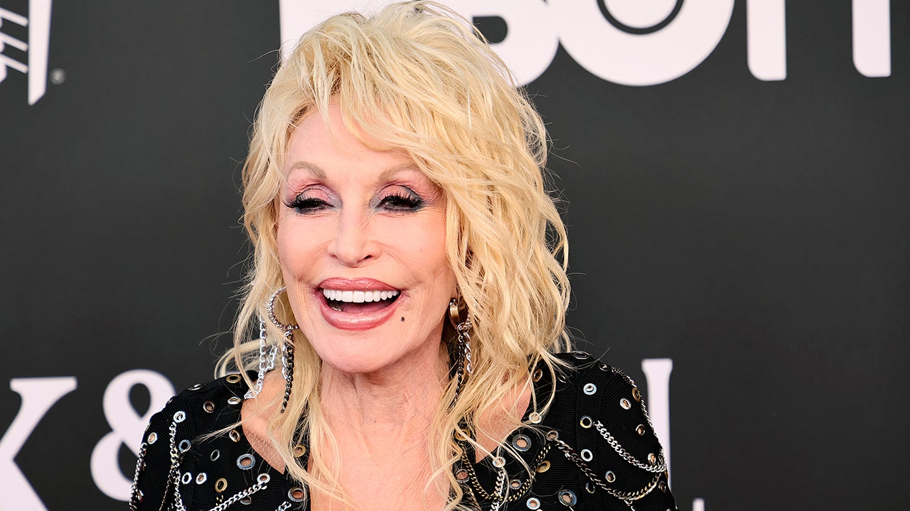 Dolly Parton isn't sure 'whose d--- idea' it was to record a secret song and bury it in Dollywood